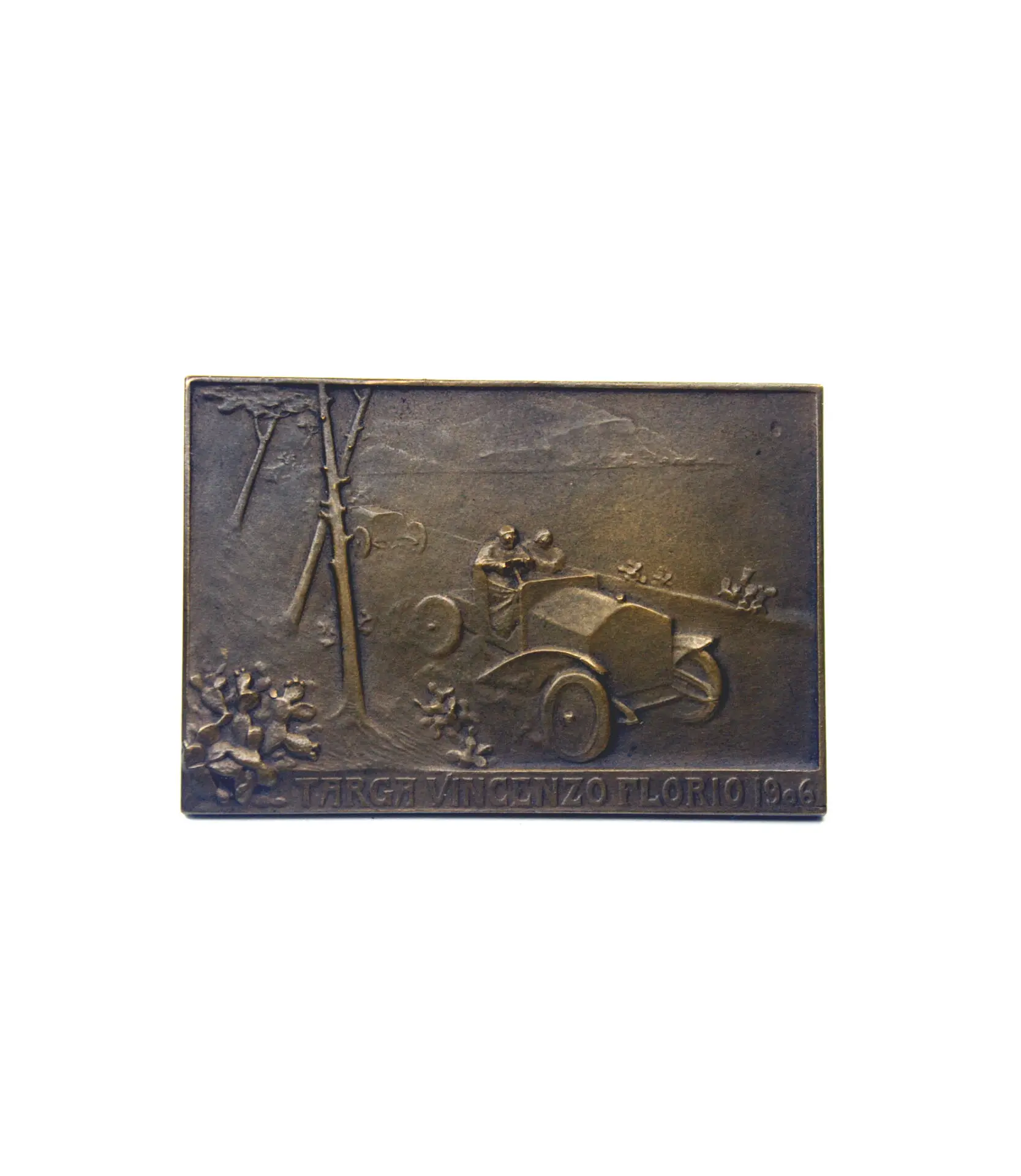 One-of-a-kind motoring collectible. Crafted by Rene Lalique, this solid bronze plaque was presented to participants, authorities and celebrities of the first Targa Florio, held on 1906. Image on relief depicting the winning Itala 35/40hp as driven to victory by Alessandro Cagno. Bronze plaque marked LALIQUE and BRONZE with correct hallmark, in very good to excellent condition. Measures 55mm x 40mm.