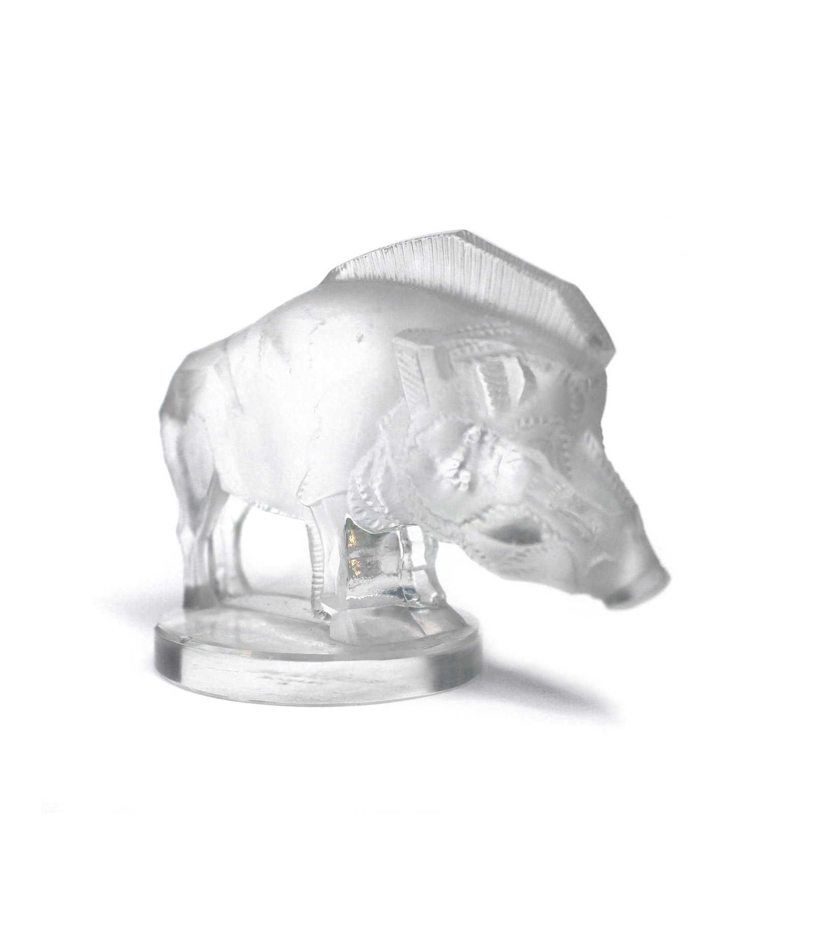 One of the 29 designs of car mascots by René Lalique. This original pre war example of the Sanglier (wild boar) is as beautiful as it was back in the late 1920s. Measures 6,5cm x 9,0cm aprox. Very good condition. Clear glass. Small (2mm chip) at the top edge of the round base. Clear moulded mark R Lalique France between legs and stencilled R Lalique France under the base.