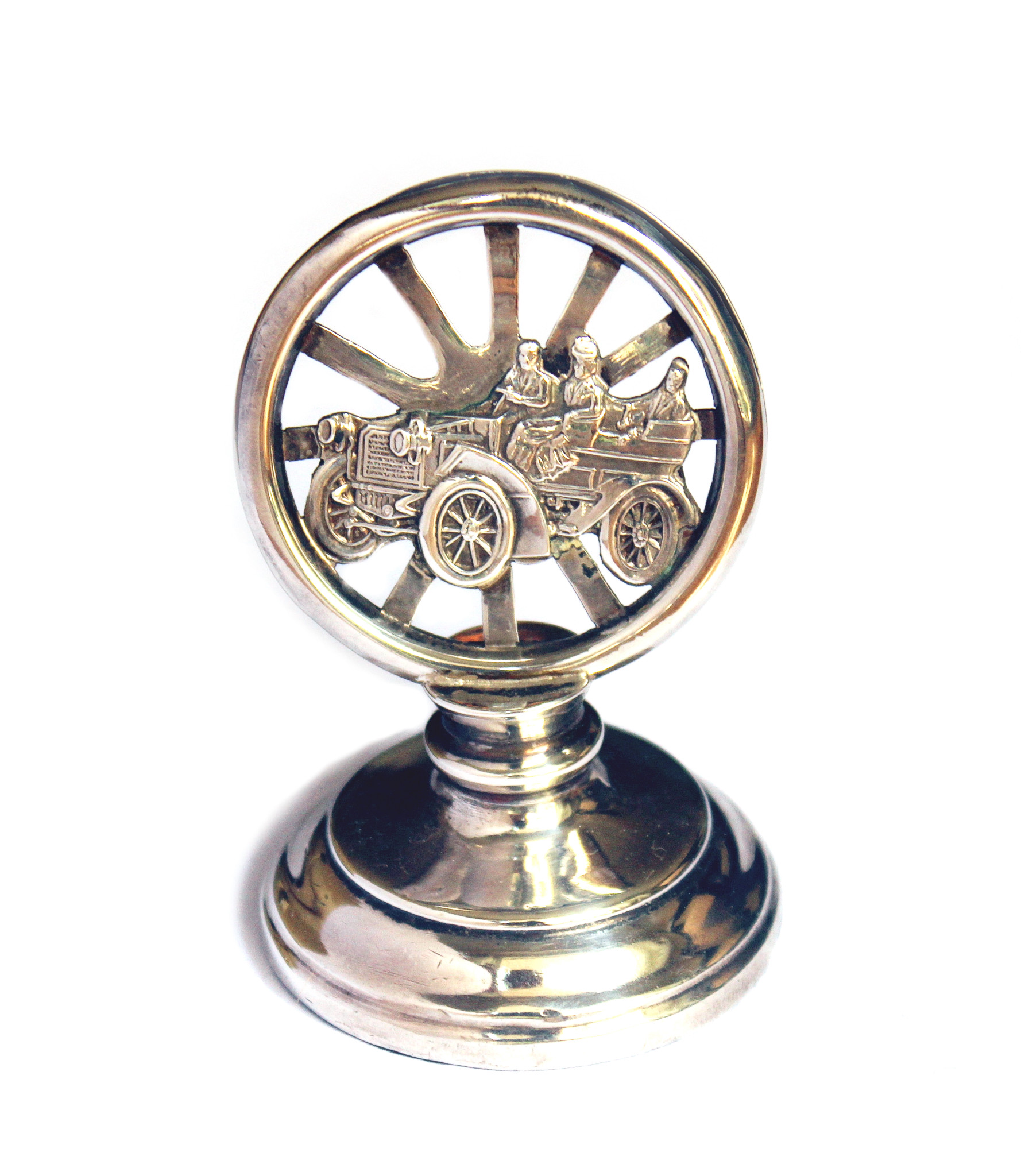 Fine silver seal by silversmith Henry Matthews of Birmingham, with an image of a early 20th century motor car in front of a wheel. Elegant desktop item of the first decade of the 20th century. Measures 6cm high. Very good condition and correctly hallmarked HM with the Birmingham date letters of 1905.