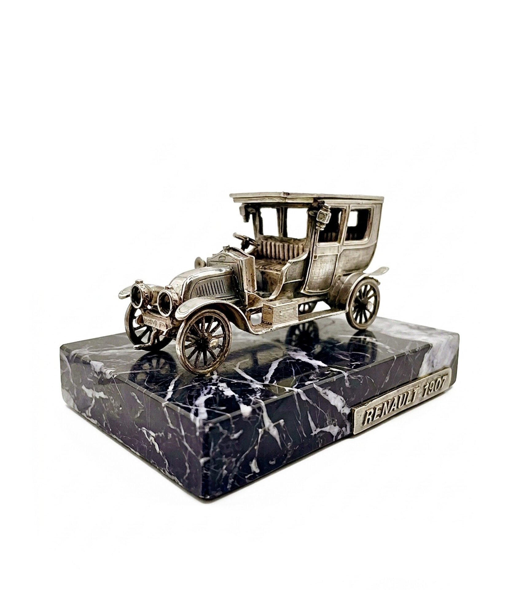 A stunning c.1960s Silver Gena Renault 1907 desk sculpture in .915 fine Spanish silver on a Negro Marquina marble base. A rare, hallmarked masterpiece.
