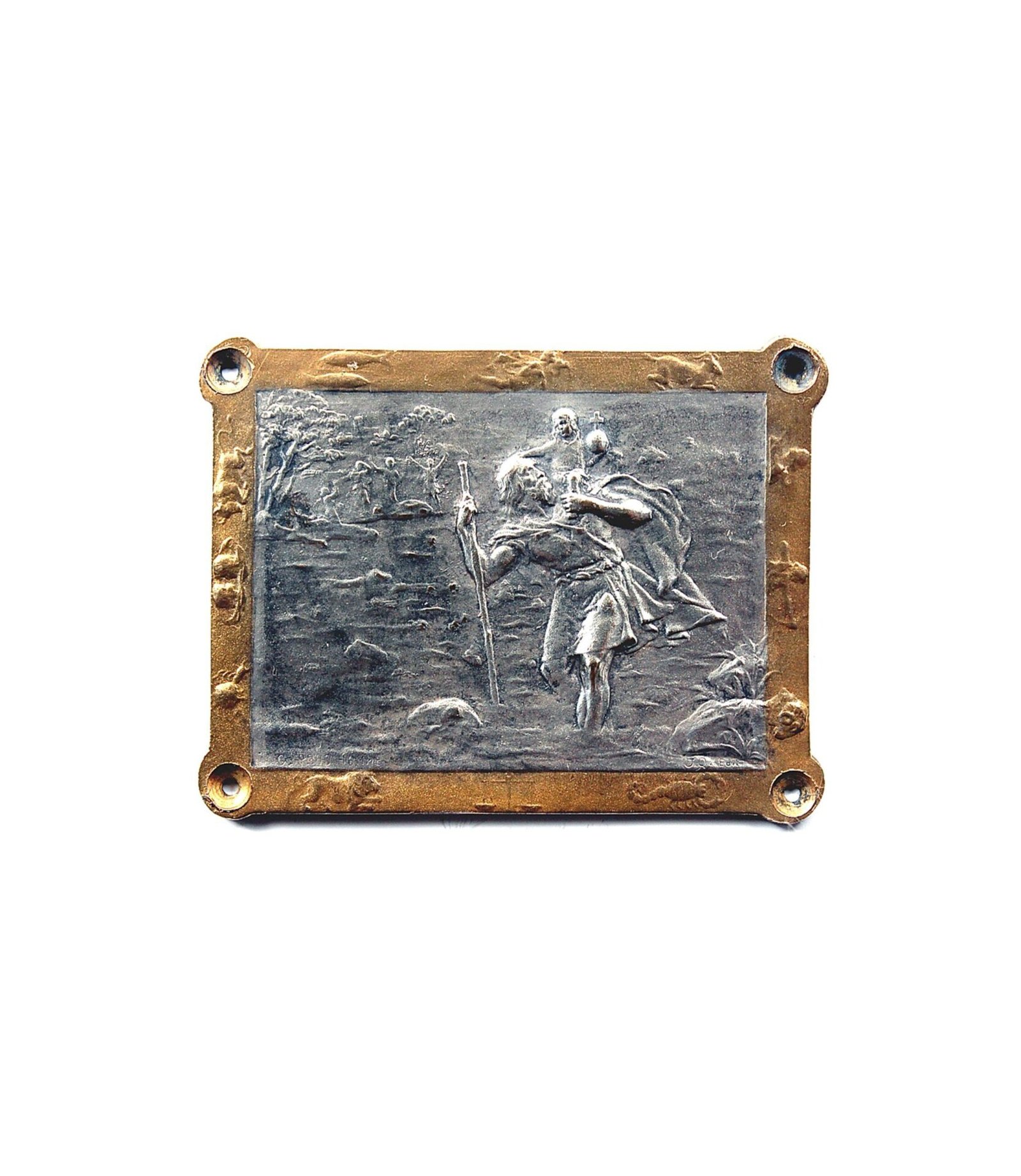 Fine Saint Christopher's dashboard badge by renowned sculptor and engraver, Georges-Henri Prud'homme (1873-1947). Presents the special feature of decorate the religious image with the Zodiac signs on borders. Sometimes is also found as interior car liquor cabinets or ashtrays decoration. Measures 50mm x 40mm aprox. Silver plated bronze with silver and patinated finish. Signed G.Prud'homme and edited by J.Q.